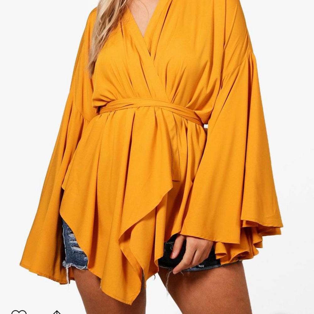 Plus size peplum extreme sleeve wrap top